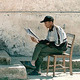 Nepalese man reading a newspaper